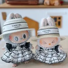 Styling Your Labubu: A Beginner's Guide to Doll Fashion 3 Two Labubu dolls wearing coordinated designer-style outfits with hats