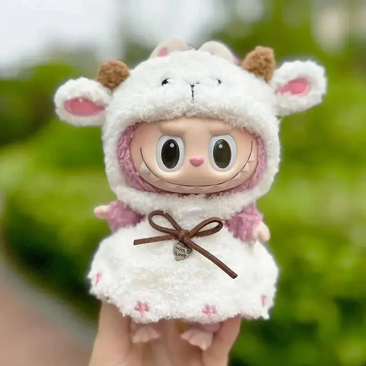 Seasonal Style for Your Labubu: Dressing Up for Every Occasion 2 Labubu doll wearing cozy knit hat and brown overalls, suitable for autumn