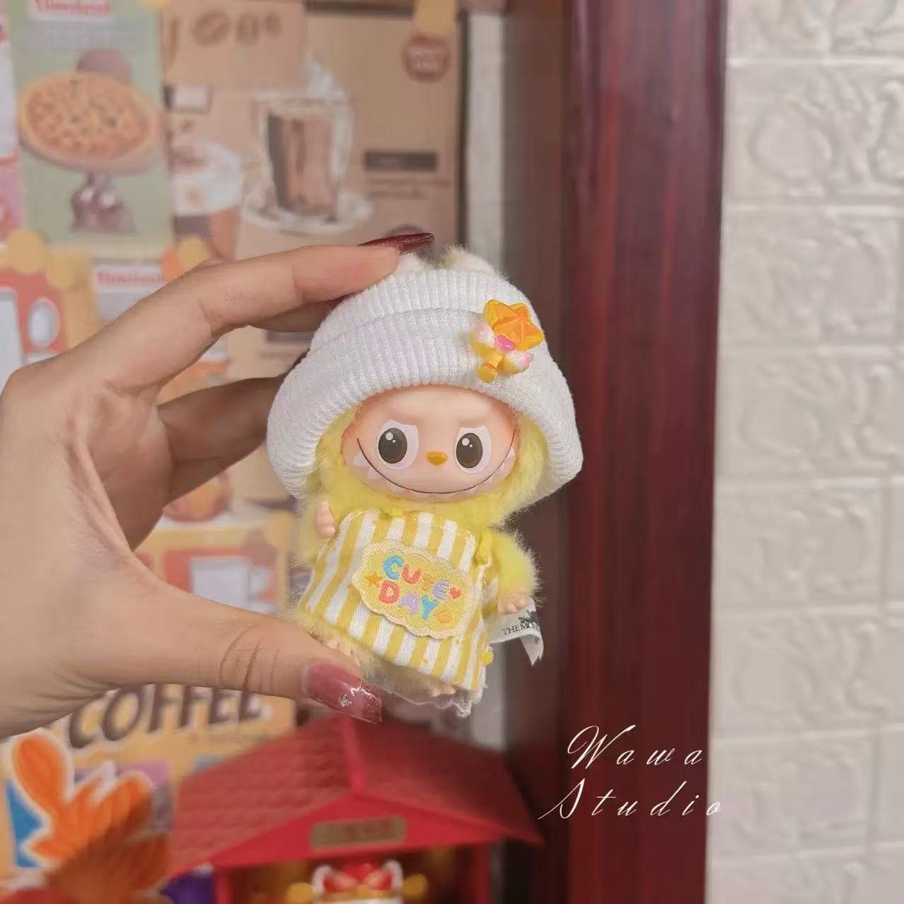 Labubu doll wearing an outfit made from recycled materials