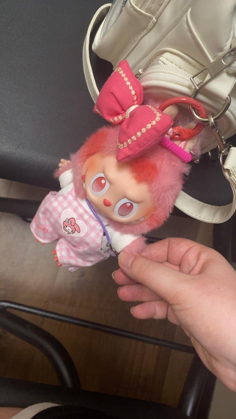 The Psychology of the Labubu Wardrobe: Part 1 - Why We Need Miniature Fashion 2 Labubu doll acting as an emotional support companion, attached to a bag.