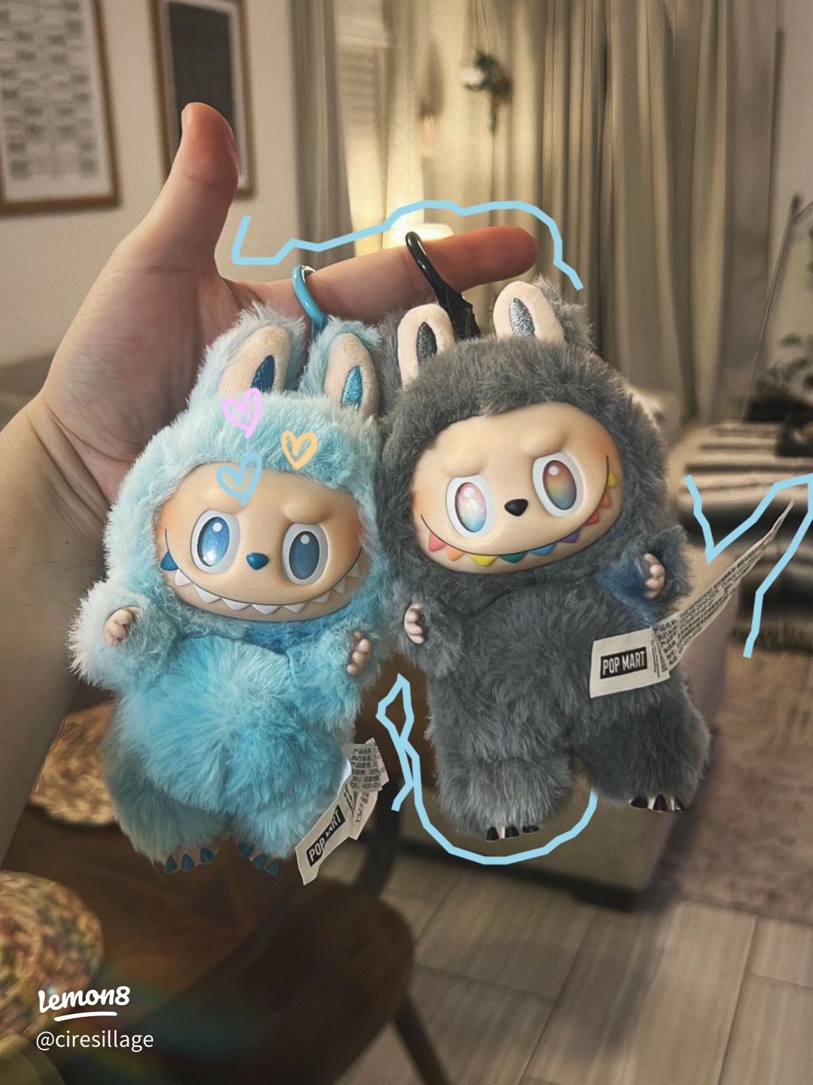 A Mini Labubu keychain plush wearing a cool, blue street-style outfit.
